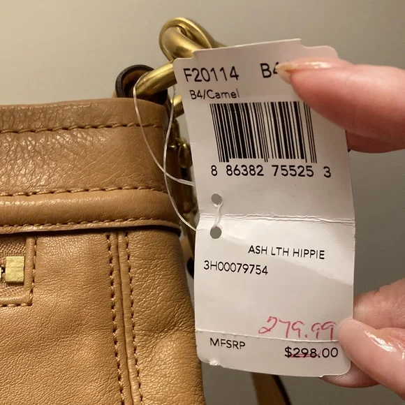 This is a coach leather bag with a shoulder strap and a carry handle - Picture 6 of 6